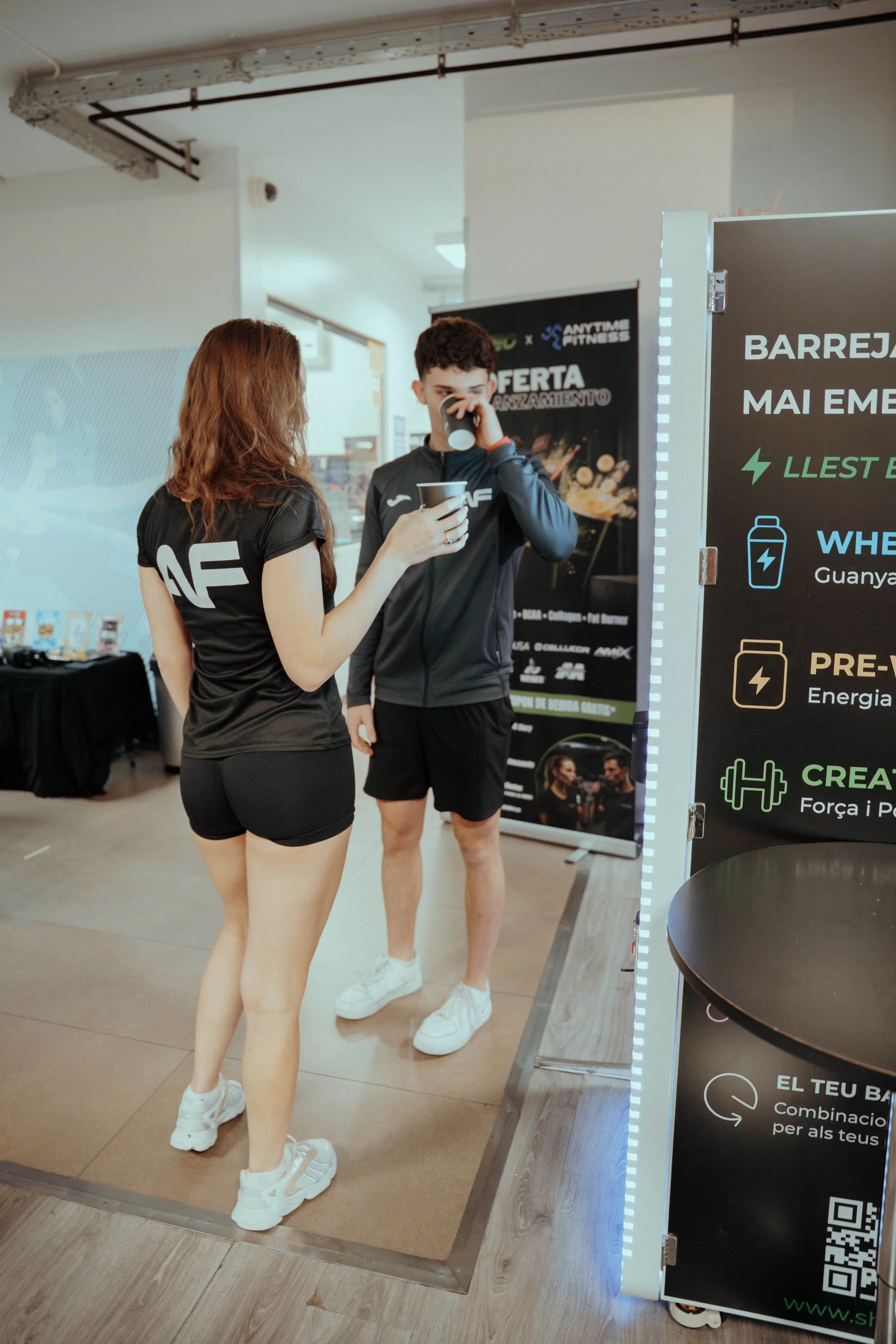 Gym members with SHAKEO promotional materials