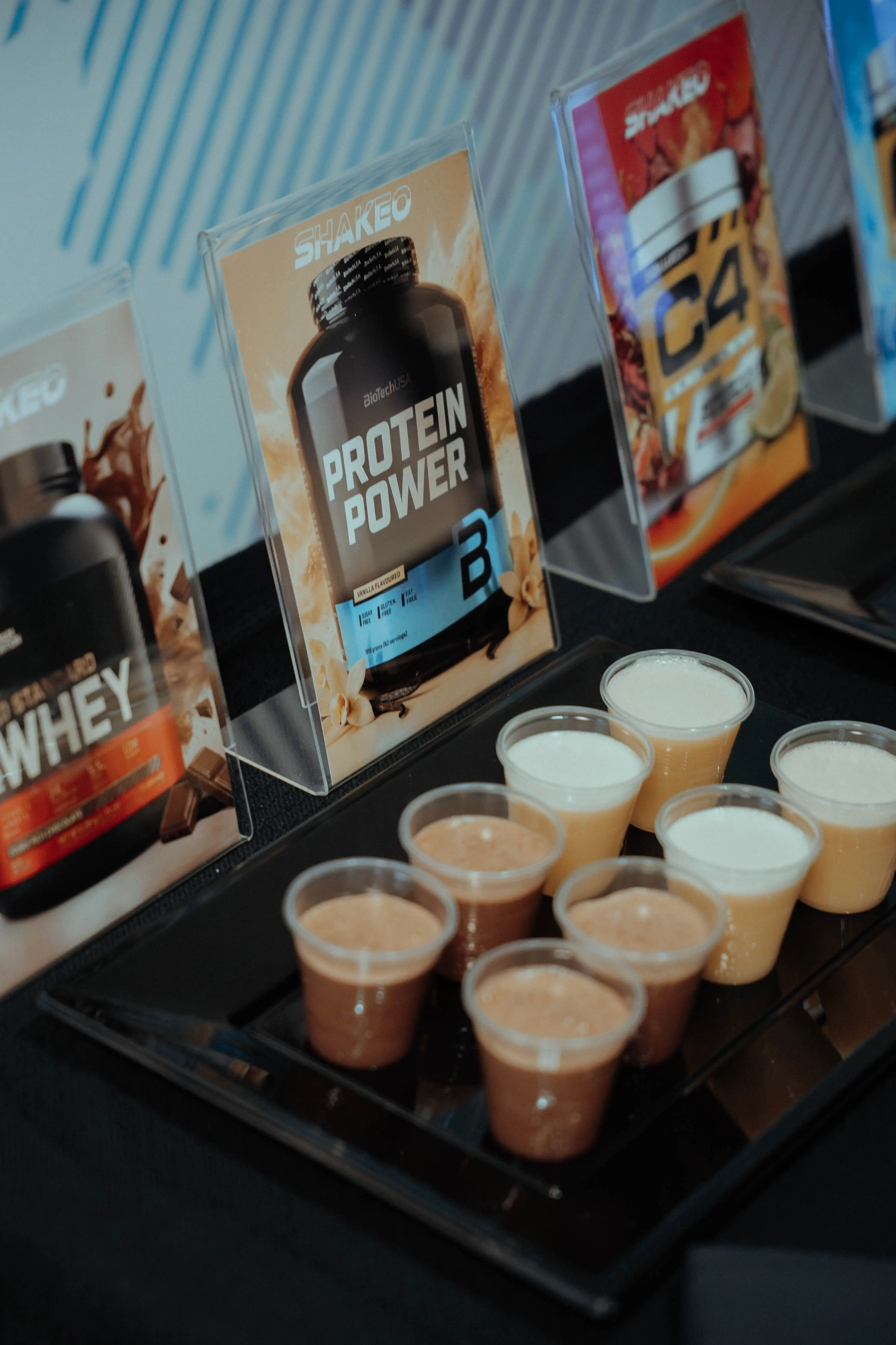 SHAKEO protein shake samples with product displays